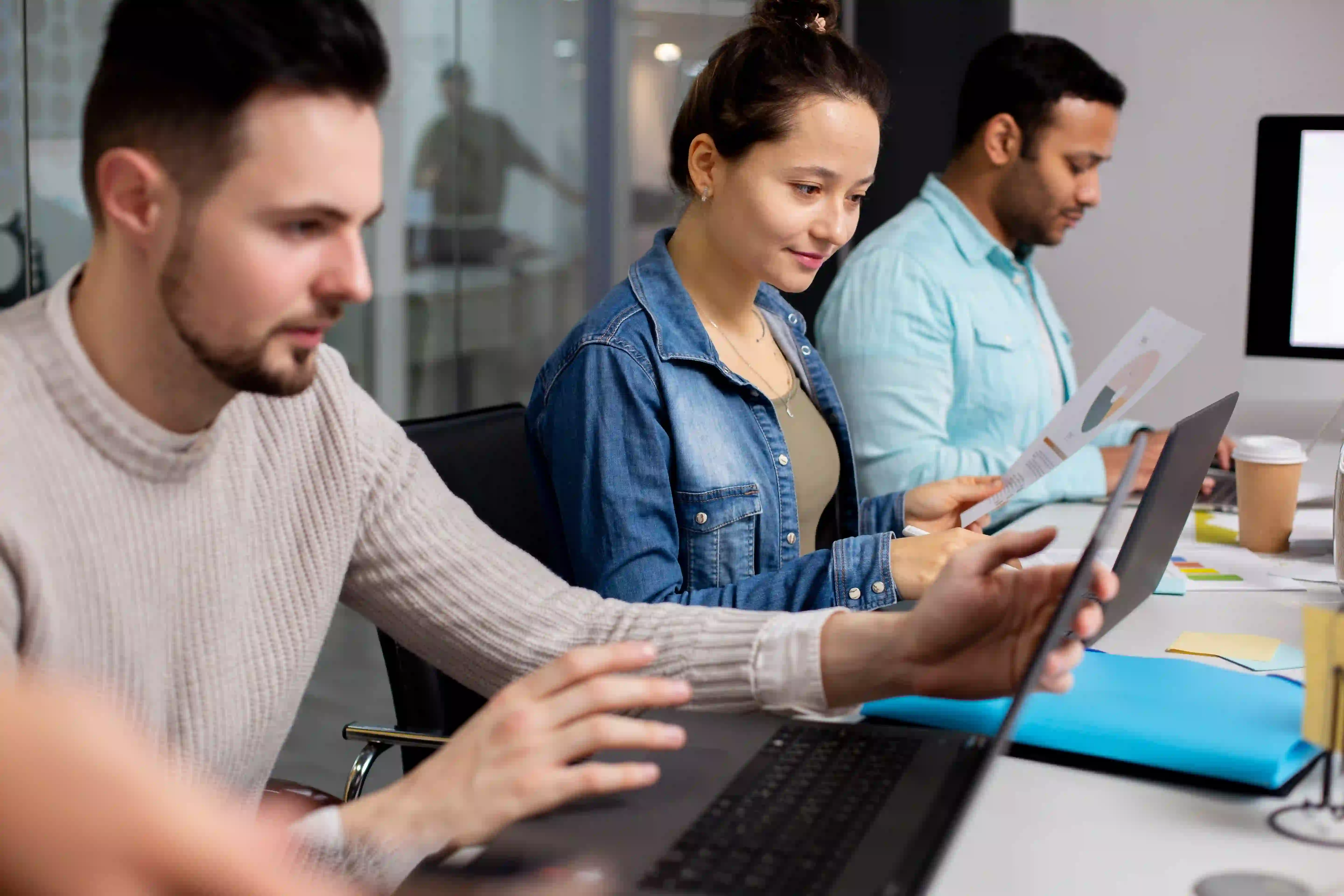 Globally connected technology professionals working across distributed locations, representing HashRoot’s global workforce management services for international teams.